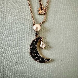 Elegant Gold and Black Crescent Moon Necklace